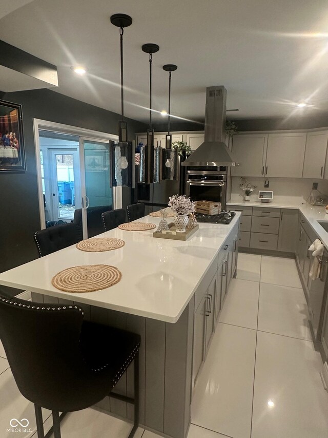 9527 Pepperidge Dr, Indianapolis, IN 46235 - kitchen featuring island range hood, appliances with stainless steel finishes, a kitchen breakfast bar, light countertops, and recessed lighting