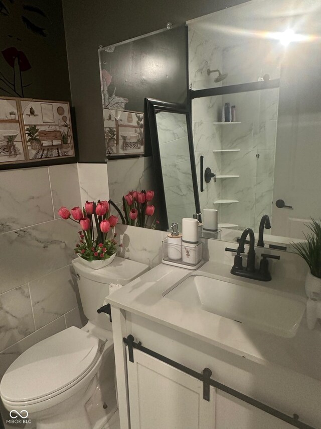 9527 Pepperidge Dr, Indianapolis, IN 46235 - bathroom featuring vanity, toilet, tile walls, and a shower