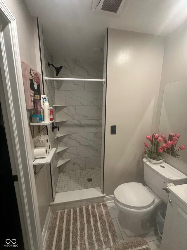 9527 Pepperidge Dr, Indianapolis, IN 46235 - bathroom with marble look tiles, vanity, toilet, and a tile shower