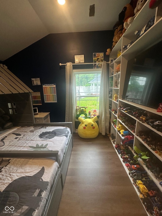 9527 Pepperidge Dr, Indianapolis, IN 46235 - bedroom with lofted ceiling and wood finished floors
