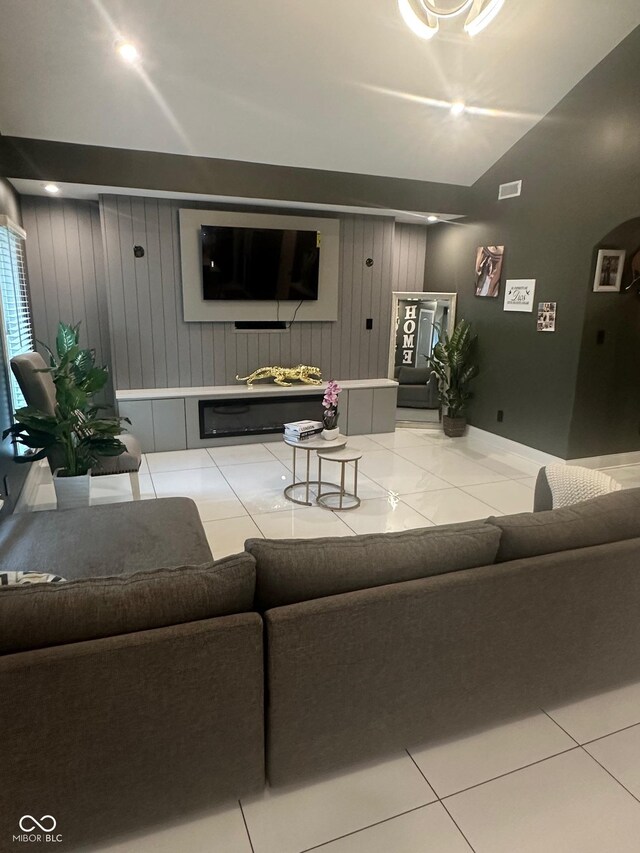 9527 Pepperidge Dr, Indianapolis, IN 46235 - living area featuring wood walls, lofted ceiling, and baseboards