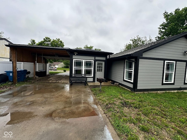 9527 Pepperidge Dr, Indianapolis, IN 46235 - ranch-style house featuring driveway, a carport, and a front lawn
