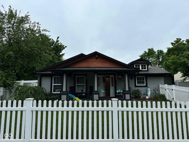 9527 Pepperidge Dr, Indianapolis, IN 46235 - bungalow-style house featuring a porch, a gate, and stucco siding