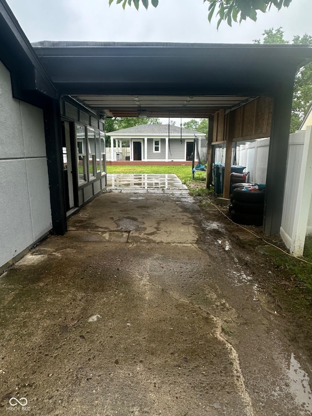 9527 Pepperidge Dr, Indianapolis, IN 46235 - view of parking featuring an attached carport