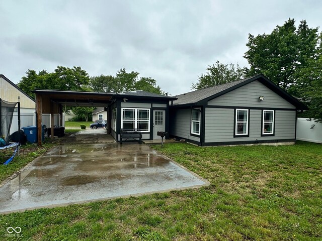 9527 Pepperidge Dr, Indianapolis, IN 46235 - ranch-style home with a carport and a front lawn