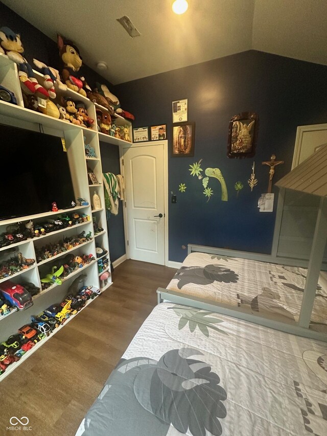 9527 Pepperidge Dr, Indianapolis, IN 46235 - bedroom with wood finished floors, lofted ceiling, and baseboards