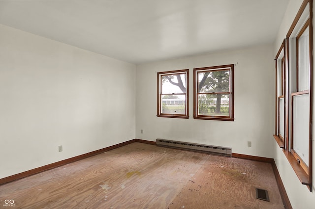 6580 N US Highway 31, Whiteland, IN 46184 - empty room featuring baseboard heating, baseboards, and wood finished floors