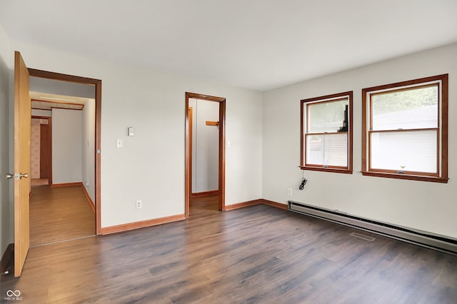 6580 N US Highway 31, Whiteland, IN 46184 - unfurnished room with baseboard heating, wood finished floors, and baseboards