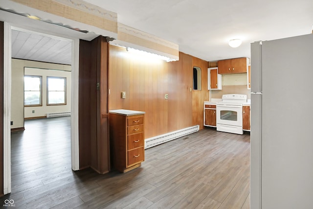 6580 N US Highway 31, Whiteland, IN 46184 - kitchen featuring white appliances, a baseboard heating unit, light countertops, and wood walls