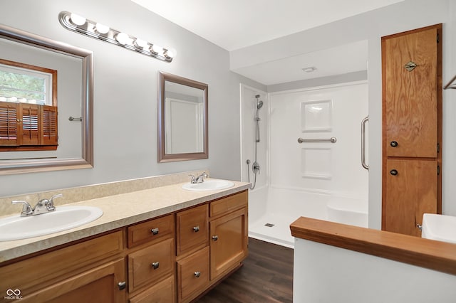 6580 N US Highway 31, Whiteland, IN 46184 - bathroom featuring double vanity, a shower, and wood finished floors