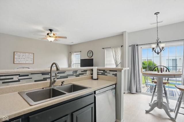 9771 Blue Violet Dr, Noblesville, IN 46060 - kitchen with dishwasher, a sink, decorative backsplash, a chandelier, and hanging light fixtures