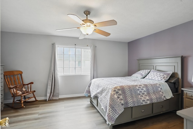 9771 Blue Violet Dr, Noblesville, IN 46060 - bedroom featuring wood finished floors, ceiling fan, and baseboards