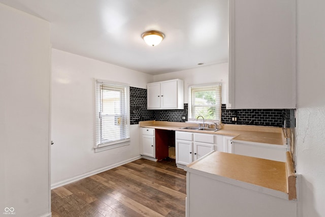 3636 Crescent Ave, Indianapolis, IN 46208 - kitchen featuring a sink, backsplash, dark wood-style floors, white cabinetry, and light countertops
