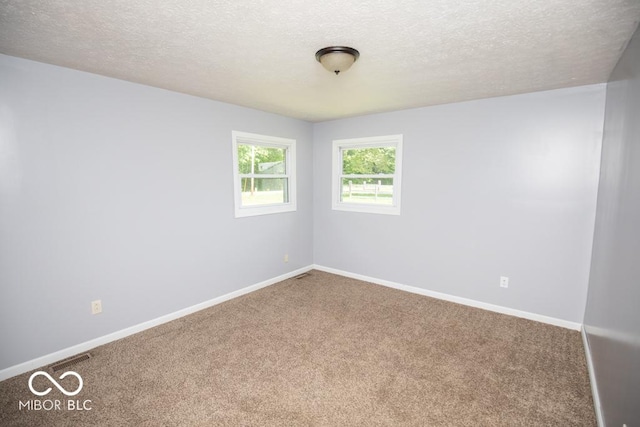 1440 N County Road 275 E, North Vernon, IN 47265 - carpeted spare room with a textured ceiling and baseboards
