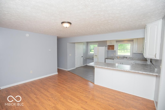 1440 N County Road 275 E, North Vernon, IN 47265 - kitchen featuring white appliances, a sink, white cabinetry, light countertops, and a textured ceiling