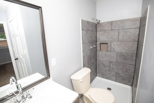 1440 N County Road 275 E, North Vernon, IN 47265 - bathroom featuring vanity, tiled shower, and toilet