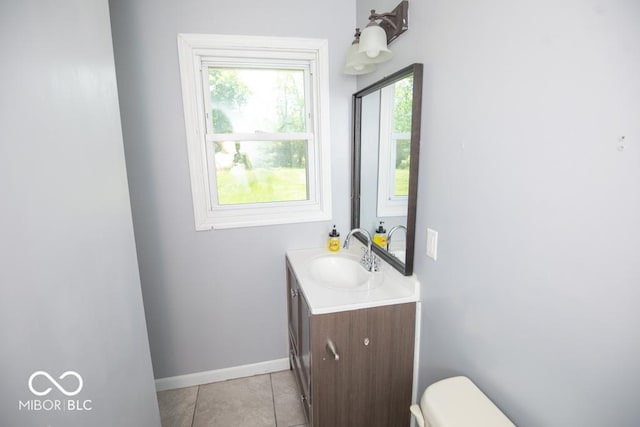 1440 N County Road 275 E, North Vernon, IN 47265 - bathroom with vanity, toilet, baseboards, and tile patterned flooring