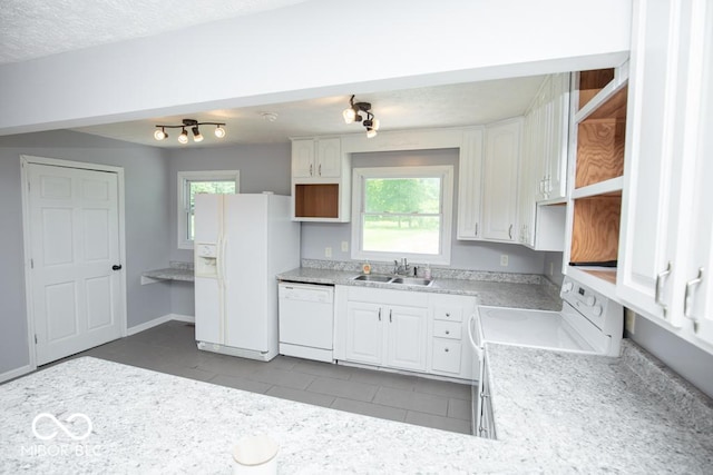 1440 N County Road 275 E, North Vernon, IN 47265 - kitchen with white appliances, a sink, white cabinetry, light countertops, and healthy amount of natural light