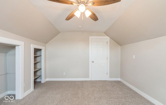 126 W Windsor St, Montpelier, IN 47359 - bonus room with carpet, ceiling fan, vaulted ceiling, built in shelves, and baseboards