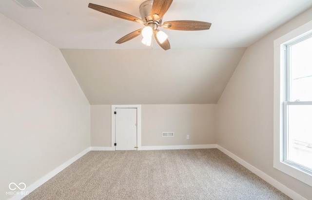 126 W Windsor St, Montpelier, IN 47359 - additional living space featuring vaulted ceiling, light carpet, baseboards, a ceiling fan, and plenty of natural light