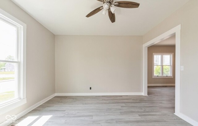 126 W Windsor St, Montpelier, IN 47359 - empty room with light wood-style flooring, ceiling fan, and baseboards
