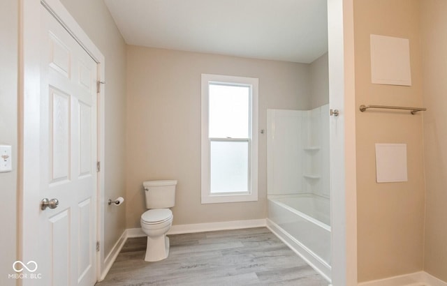 126 W Windsor St, Montpelier, IN 47359 - full bath with toilet, wood finished floors,  shower combination, and baseboards