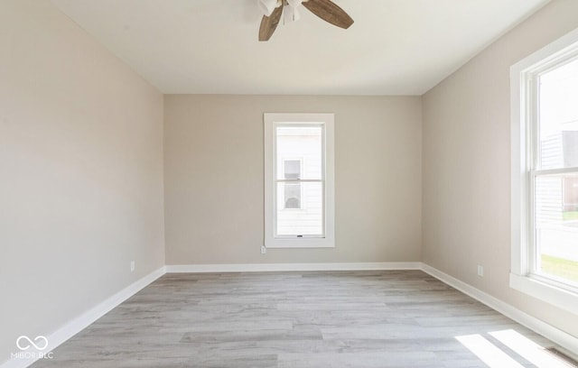 126 W Windsor St, Montpelier, IN 47359 - unfurnished room with a ceiling fan, light wood finished floors, and baseboards