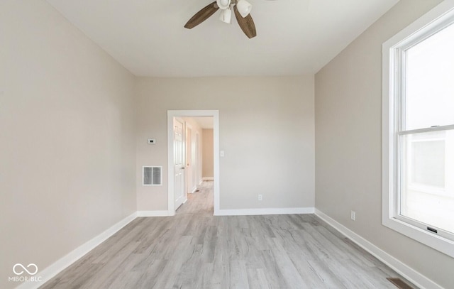 126 W Windsor St, Montpelier, IN 47359 - unfurnished room featuring a ceiling fan, light wood-style floors, and baseboards