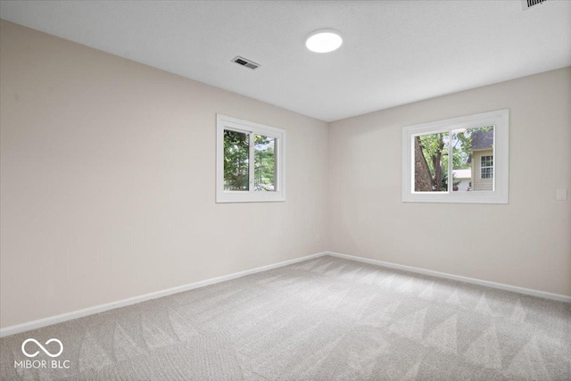 11123 Haverstick Rd, Carmel, IN 46033 - carpeted empty room featuring baseboards and plenty of natural light