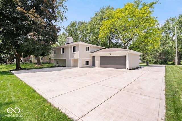 11123 Haverstick Rd, Carmel, IN 46033 - view of front of property featuring concrete driveway, a front lawn, an attached garage, a chimney, and brick siding
