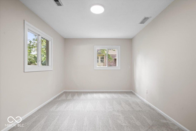 11123 Haverstick Rd, Carmel, IN 46033 - empty room with carpet flooring, healthy amount of natural light, and baseboards
