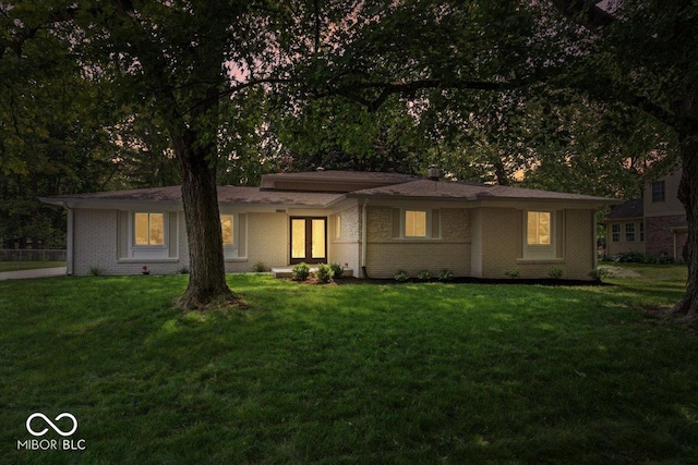 11123 Haverstick Rd, Carmel, IN 46033 - view of front of property with a front lawn, brick siding, and french doors
