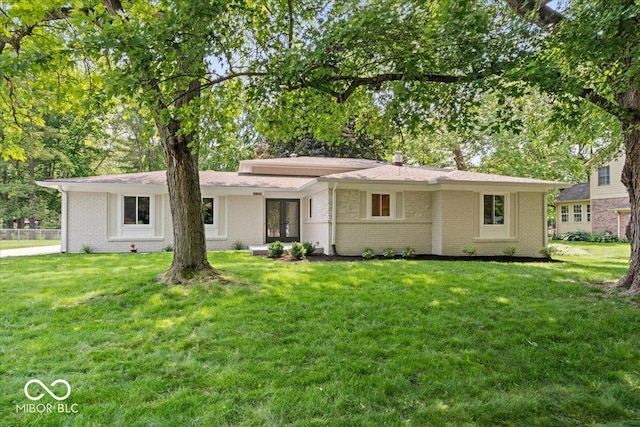 11123 Haverstick Rd, Carmel, IN 46033 - view of front of house featuring brick siding, a front yard, and french doors