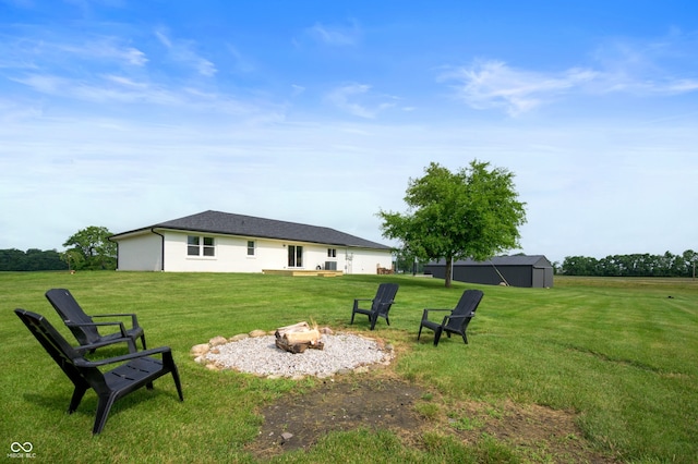 10274 S 400 W, Pendleton, IN 46064 - view of grassy yard with an outdoor fire pit and an outdoor structure