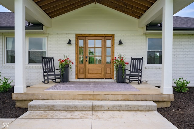 10274 S 400 W, Pendleton, IN 46064 - doorway to property with brick siding, a porch, and a shingled roof