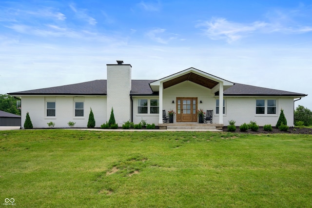 10274 S 400 W, Pendleton, IN 46064 - view of front of house with a chimney, a front yard, brick siding, and a shingled roof