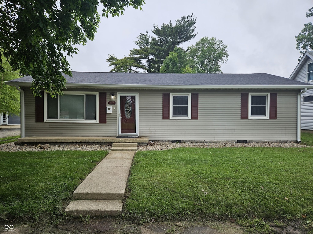 ranch-style house with a front yard and crawl space