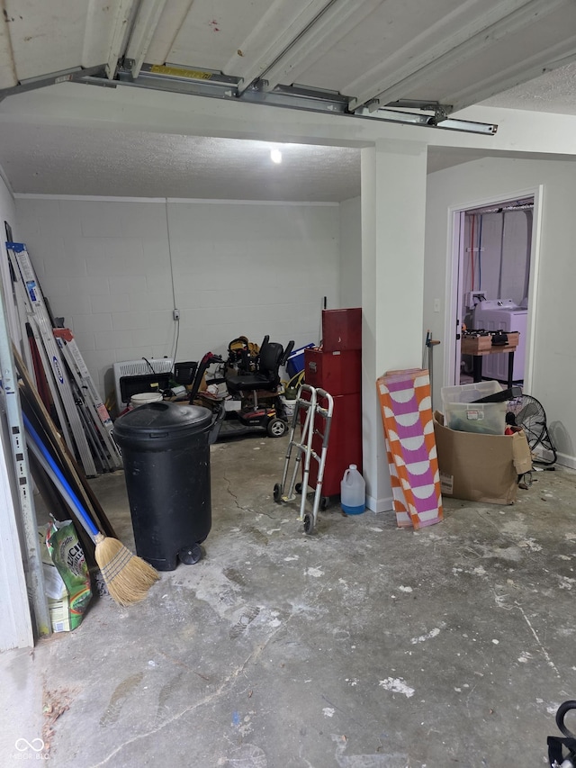 6305 W Hickory Hill Dr, North Vernon, IN 47265 - garage with washer / clothes dryer and concrete block wall