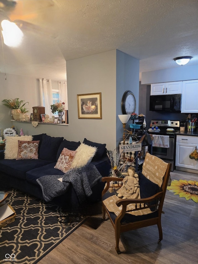 6305 W Hickory Hill Dr, North Vernon, IN 47265 - living area featuring wood finished floors and a textured ceiling
