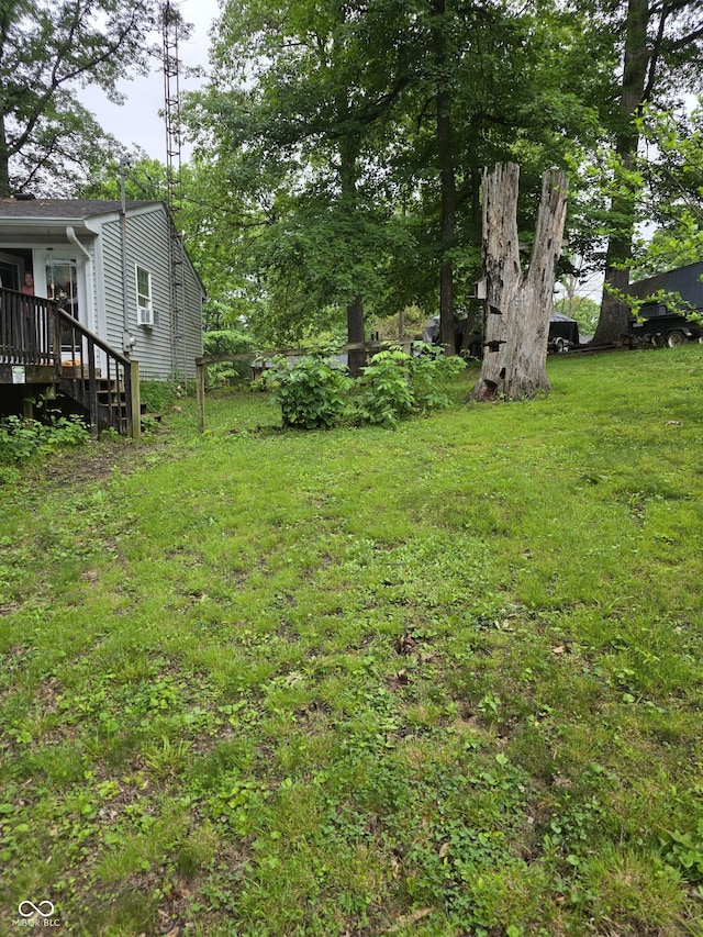 6305 W Hickory Hill Dr, North Vernon, IN 47265 - view of green lawn with a wooden deck