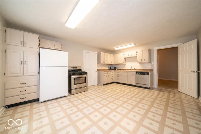 5 E Jefferson St, Maxwell, IN 46154 - kitchen featuring appliances with stainless steel finishes, light floors, a sink, and light countertops