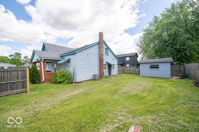 5 E Jefferson St, Maxwell, IN 46154 - rear view of property with a chimney, an outdoor structure, and central air condition unit