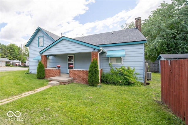 5 E Jefferson St, Maxwell, IN 46154 - bungalow with covered porch, a chimney, roof with shingles, brick siding, and central AC unit