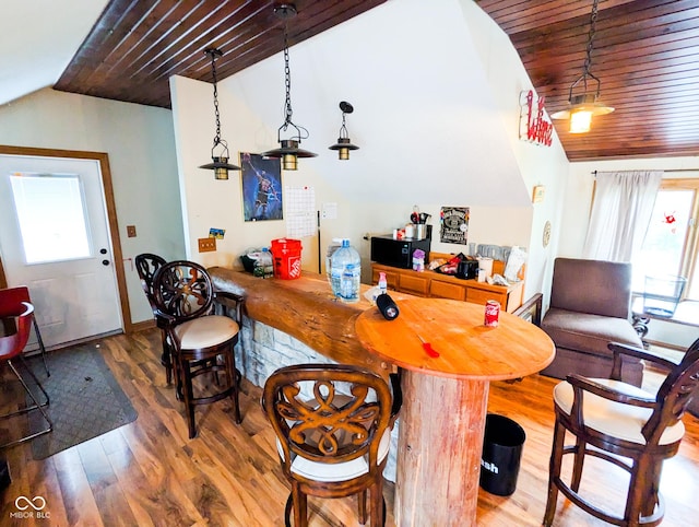 6336 N Carroll Rd, Indianapolis, IN 46235 - bar area featuring lofted ceiling, wood finished floors, wood ceiling, pendant lighting, and baseboards