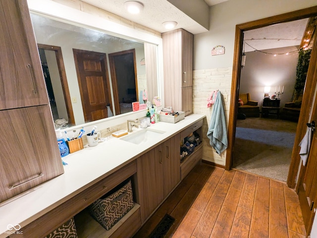 6336 N Carroll Rd, Indianapolis, IN 46235 - ensuite bathroom featuring hardwood / wood-style flooring and vanity