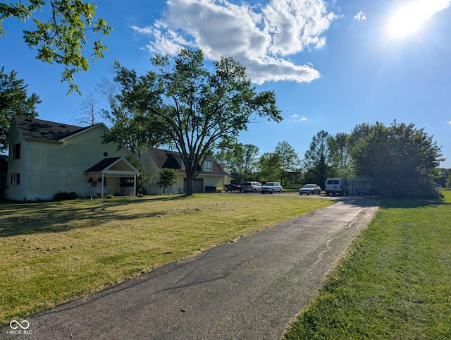 6336 N Carroll Rd, Indianapolis, IN 46235 - view of front of house featuring a front yard and driveway