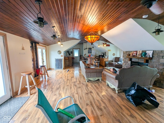 6336 N Carroll Rd, Indianapolis, IN 46235 - living room with lofted ceiling, wood ceiling, wood finished floors, a fireplace, and baseboards