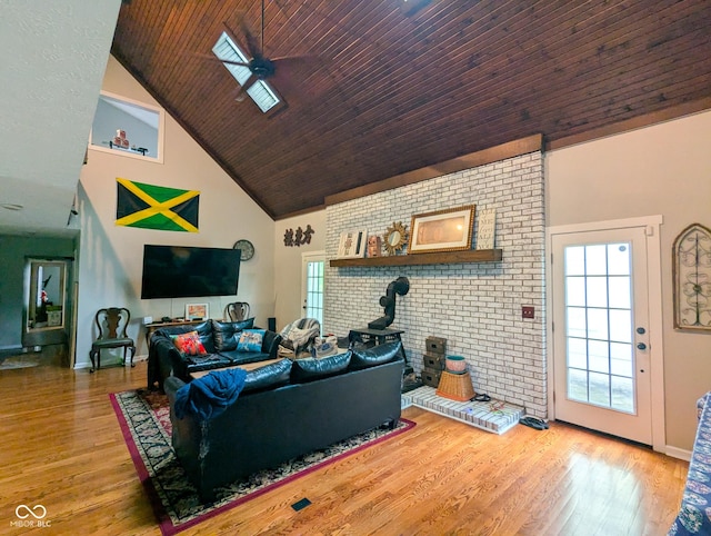 6336 N Carroll Rd, Indianapolis, IN 46235 - living area featuring high vaulted ceiling, a wood stove, a ceiling fan, wood finished floors, and wooden ceiling