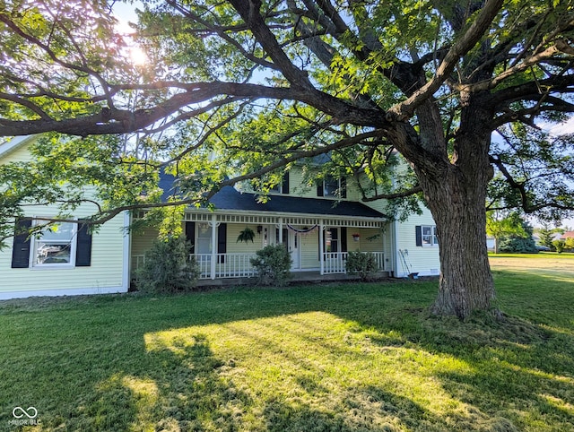 6336 N Carroll Rd, Indianapolis, IN 46235 - view of front of property with a porch and a front lawn