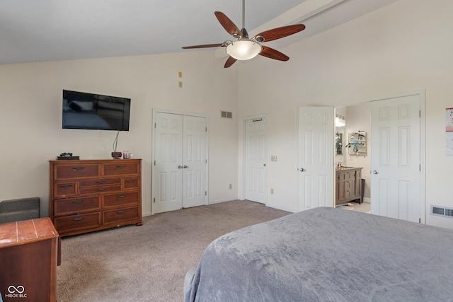 8376 Glen Highlands Dr, Indianapolis, IN 46236 - carpeted bedroom featuring high vaulted ceiling, two closets, baseboards, a ceiling fan, and connected bathroom